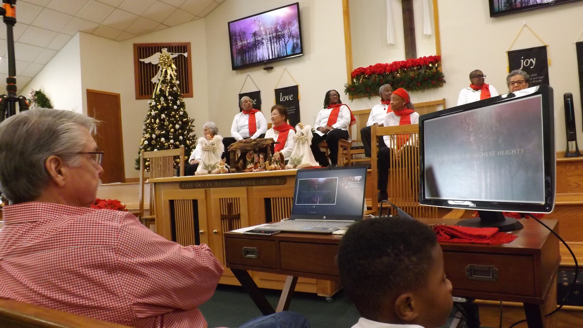 Worship team leading a seasonal presentation at the front of the church
