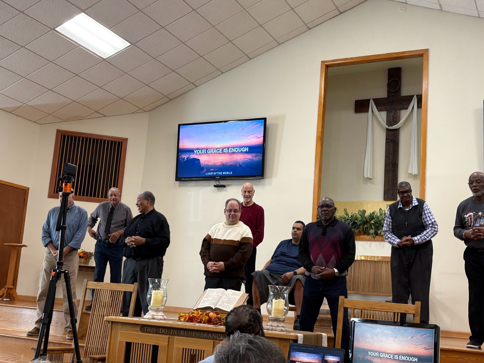 Church leaders gathered at the front during a worship service